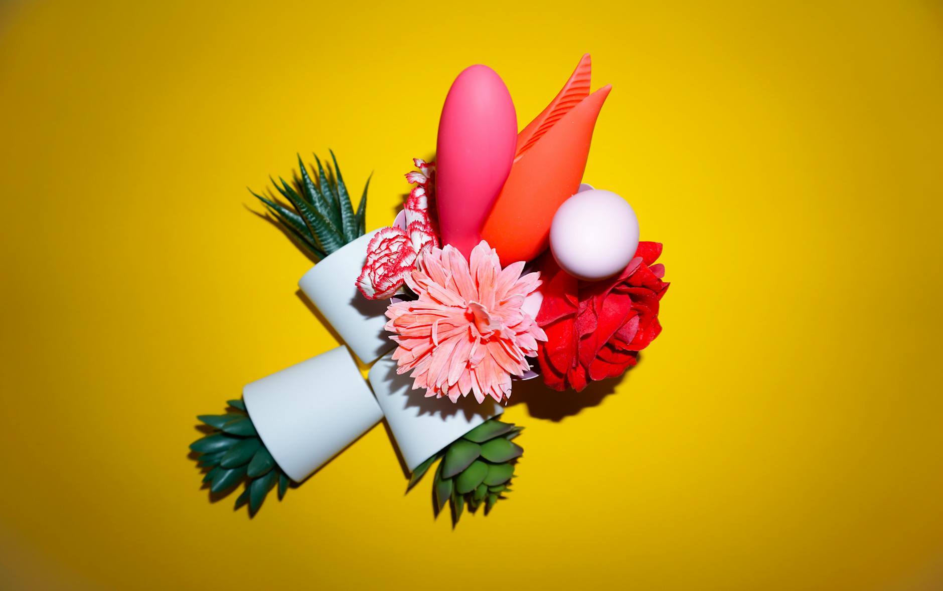 Colorful arrangement of abstract objects on a bright yellow background representing varied sensations and moods